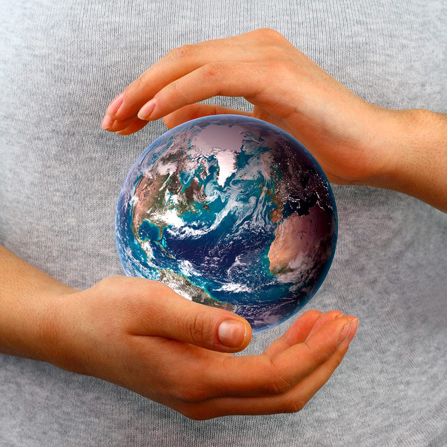 Globe between hands